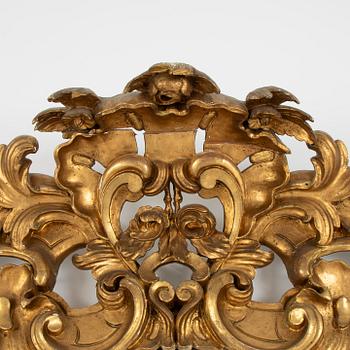 A large rococo-revival gilt-gesso mirror, later part 19th century.