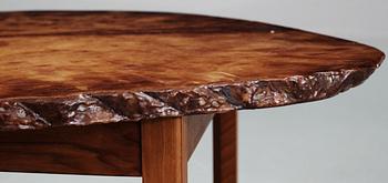 A Josef Frank agate top table on a mahogany base, by Svenskt Tenn.