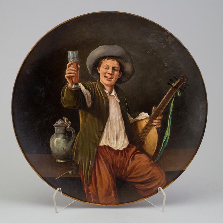 A wall plate by Adolf Neumann, Rörstrand, signed on verso 1884.