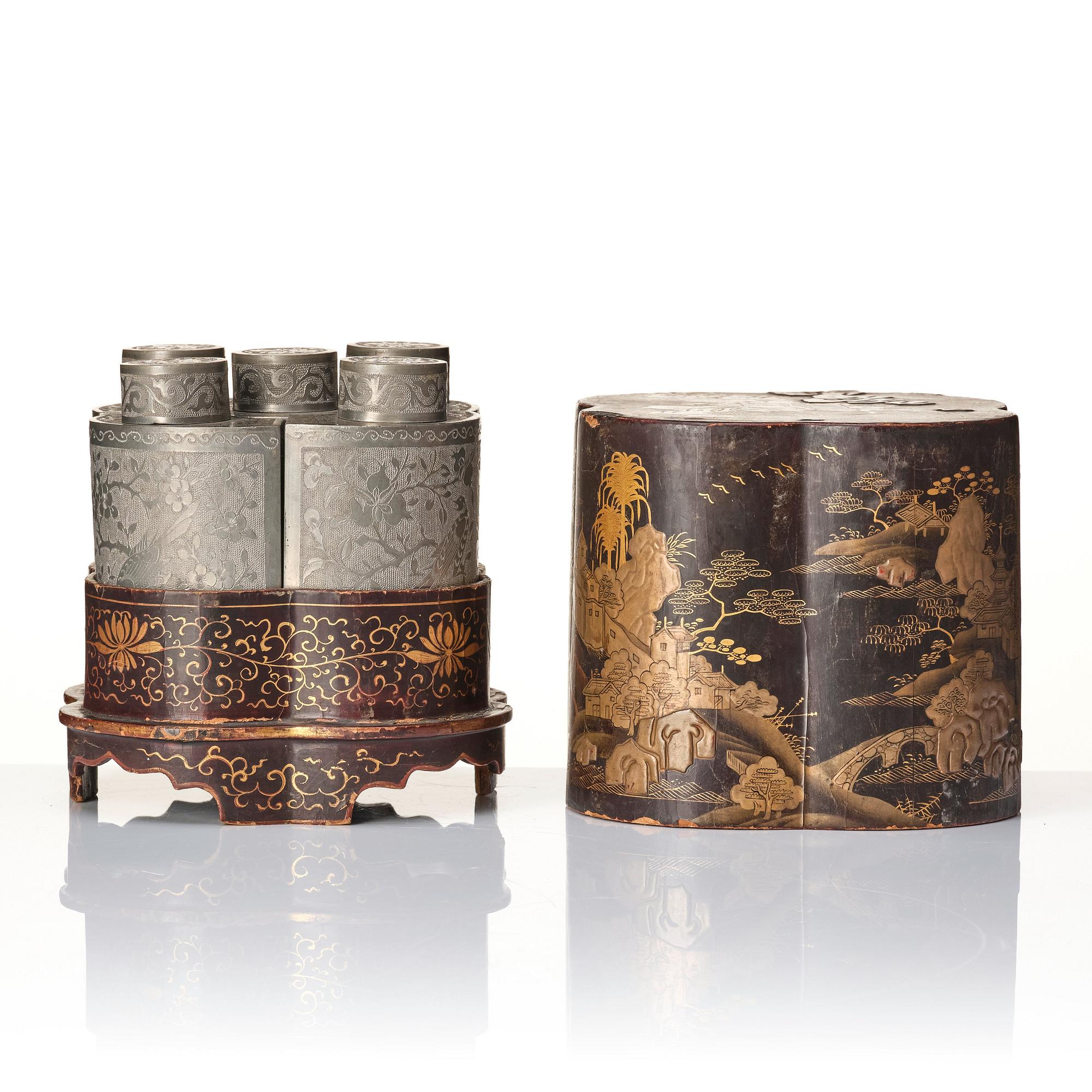 A Chinese lacquer box with a set of five pewter tea caddies, Qing dynasty, 18/19th Century.
