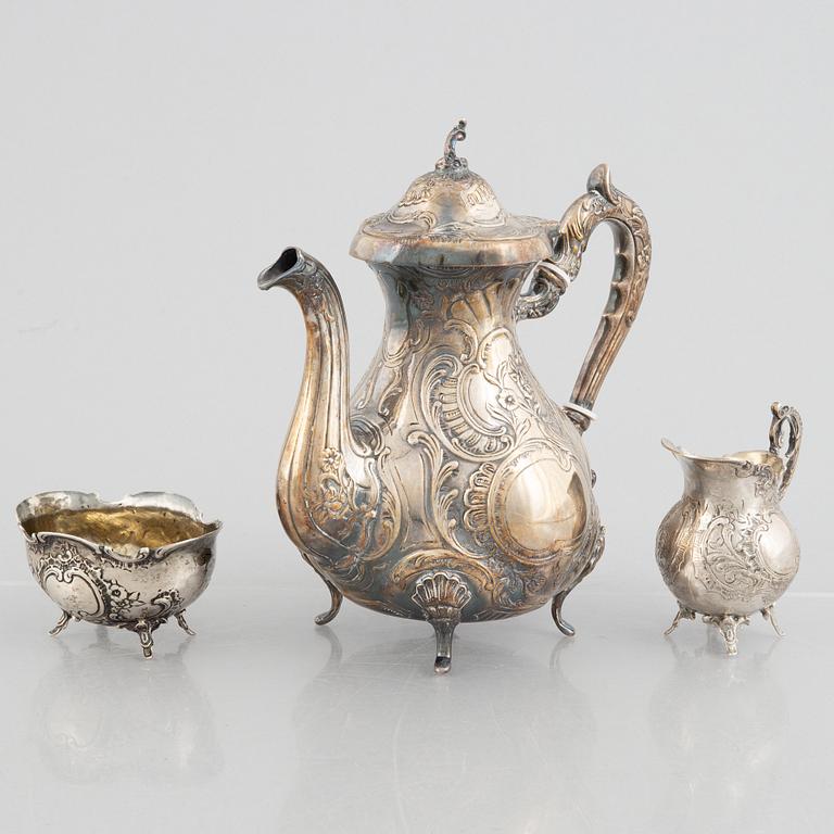 A silver coffee pot, creamer and sugar bowl, including GEWE, Malmö 1973. Rococo style.