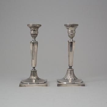 A pair of Russian silver candlesticks, Moscow, 1880, marked LM.