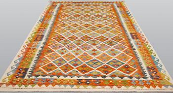 A kilim carpet, ca 306 x 203 cm.