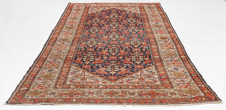 An antique Malayer carpet, west persia c 402 x 178 cm.