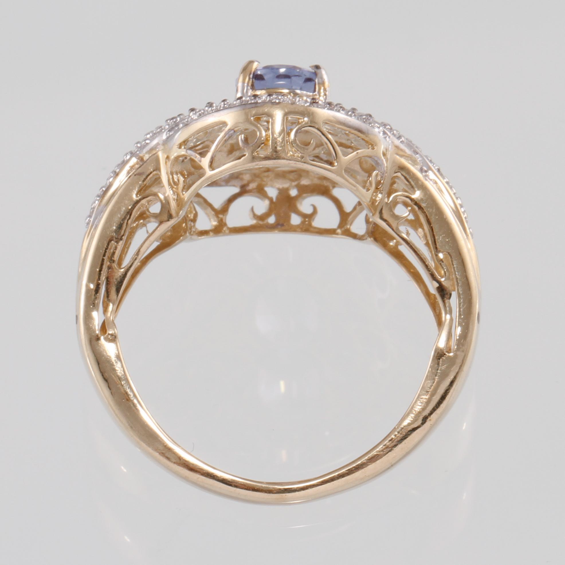 RING, 14k guld med briljant och baguett och briljantslipade diamanter samt fasettslipad tanzanit. Vikt 5 g.