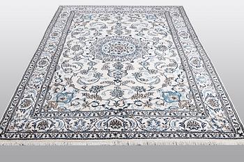 A carpet, Nain, 285 x 196 cm.
