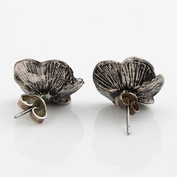 Necklace with matching earrings, white metal in floral design with glass stones.