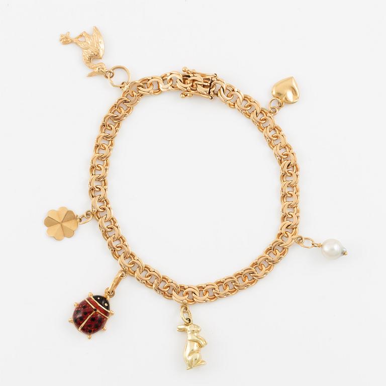Bracelet 18K gold with charms.