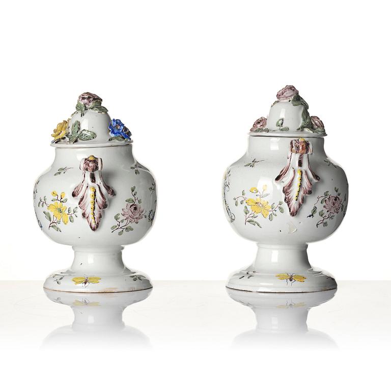 A pair of fainece potpurri jars with covers, Northern Europe, 18th century.