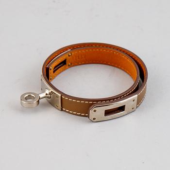 Hermès, a taupe leather 'Kelly Double' bracelet, size XS, 2013.
