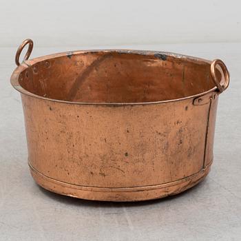 A 19th century copper cauldron.