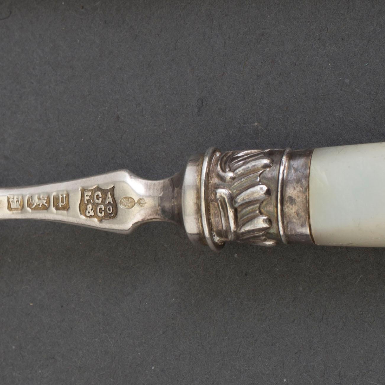 A set of 24 silver and mother of pearl cutlery by  Frederick C. Asman & Co, Sheffield, England, 1907.