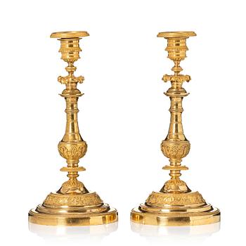 A pair of French Empire candlesticks.
