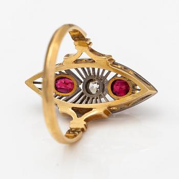 An 18K gold ring with red spinels and an old-cut diamond ca. 0.25 ct.