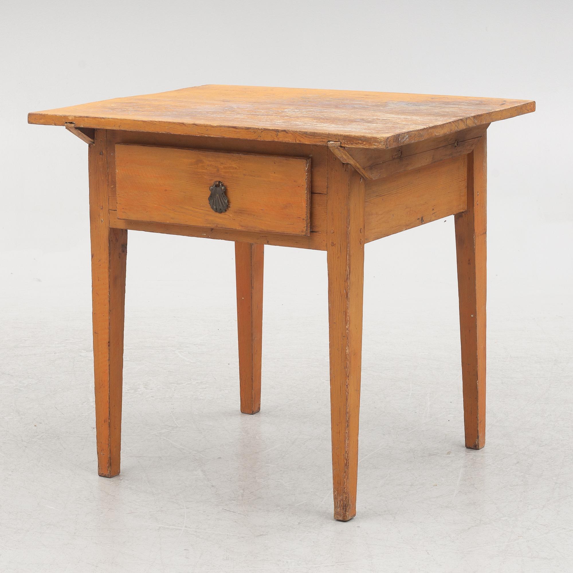 A table with drawer, 19th century.
