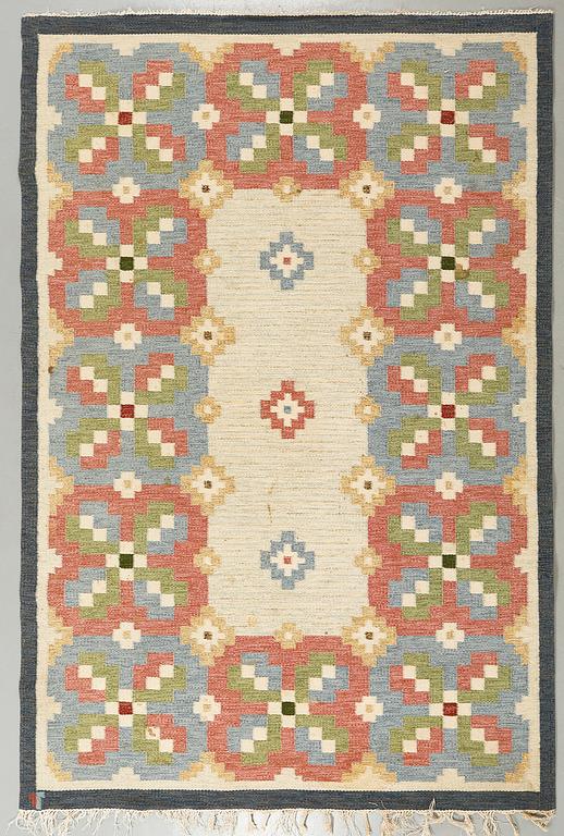 A flatweave rug by Erik Lundberg, Vävaregården, signed, 246 x 170 cm.