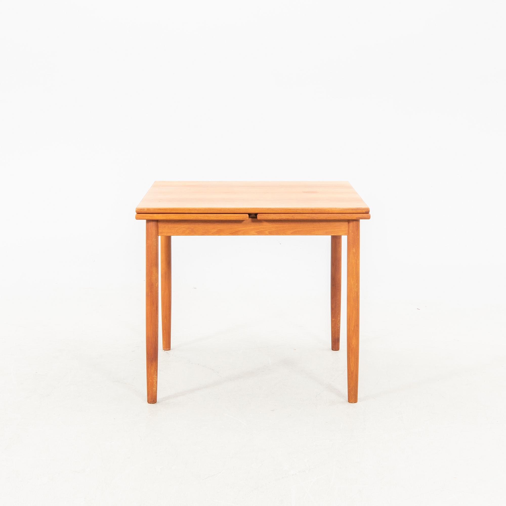 A teak table from the middle of the 20th century.