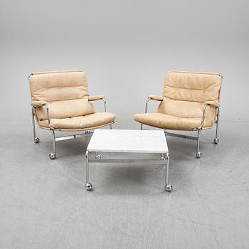 Bruno Mathsson, a pair of easy chairs and a coffee table, 'Karin', Dux, second half of the 20th Century.