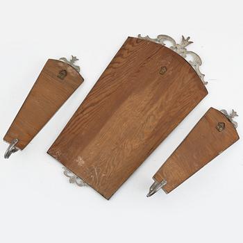 A Swedish Grace mirror and a pair of wall sconces, 1920's/30's.