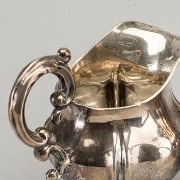 A DANISH COFFEE POT AND A SWEDISH CREAMER, silver.