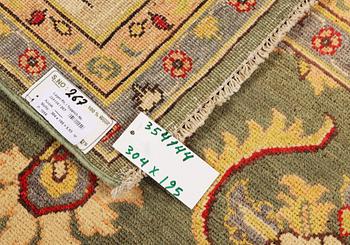 A Kazak carpet, c. 304 x 195 cm.