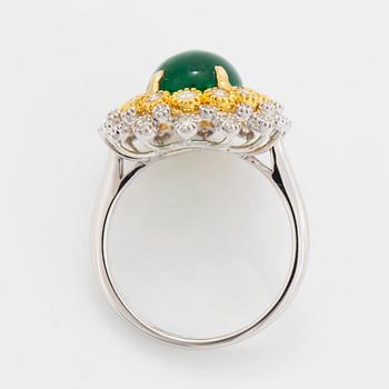 Cabochon-cut emerald and brilliant-cut diamond ring.