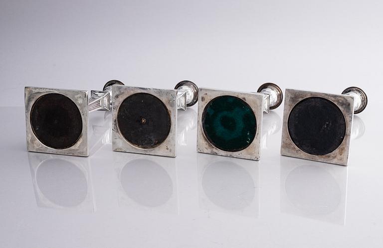 Four early 20th century silver candlesticks, marks of Hawksworth, Eyre & Co Ltd, Sheffield, England 1904-1906.