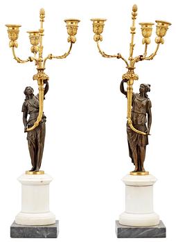 A pair of Louis XVI 18th century gilt and patinated bronze and marble three-light candelabra.