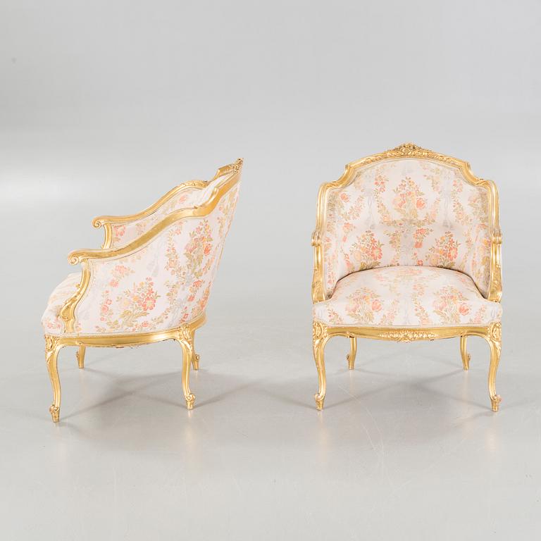 A pair of rococo style bergères, late 19th century.