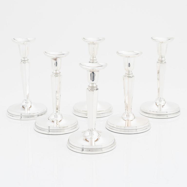 A set of six silver candle sticks, 1960-89.