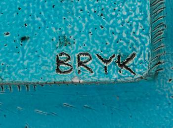 A ceramic relief signed Bryk.