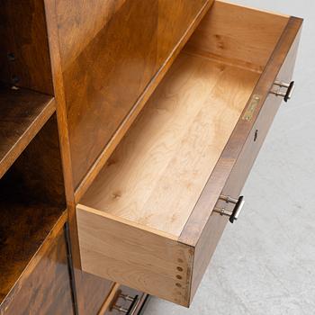 A 1930's birch-veneered bookcase.