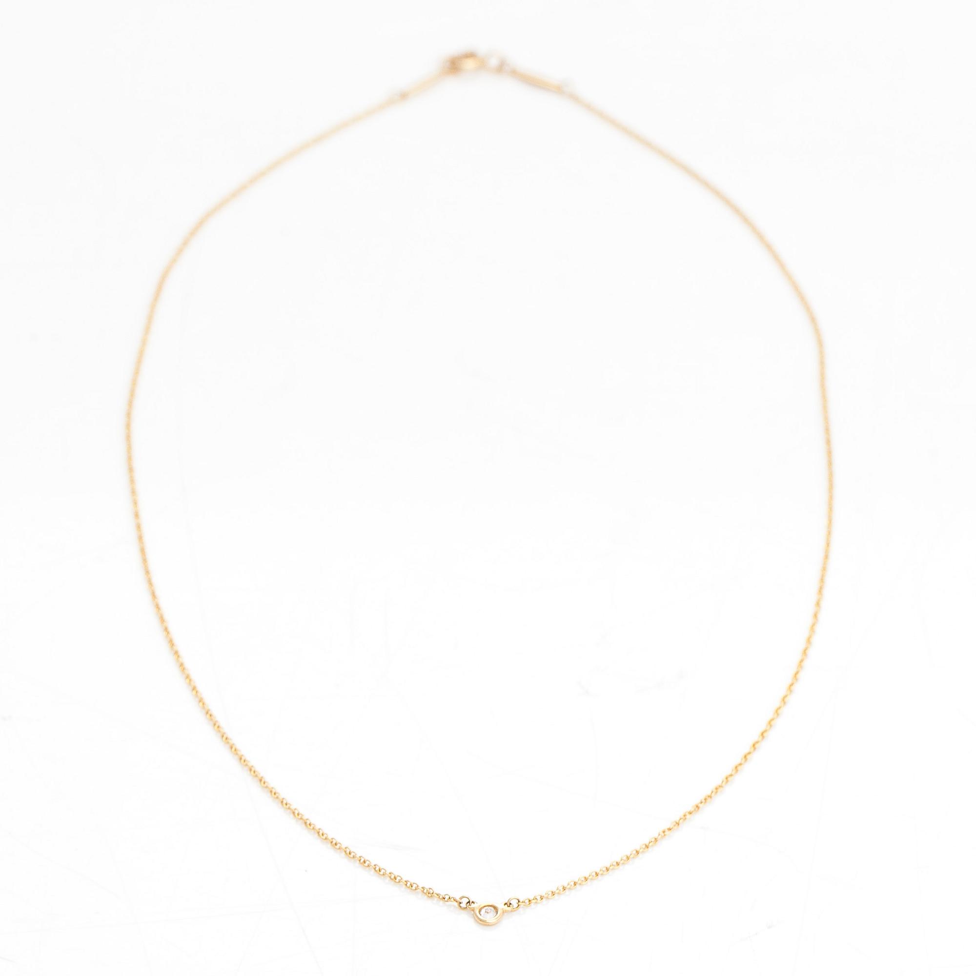 Tiffany & Co, Elsa Peretti, an 18K gold necklace with a ca. 0.05 ct diamond.