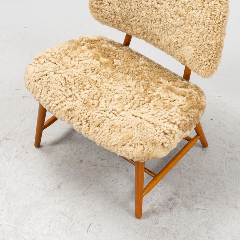 Alf Svensson, a 'TeVe' easy chair, with new sheepskin upholstery. Bra Bohag, Studio Ljungs Industrier, 1950's.