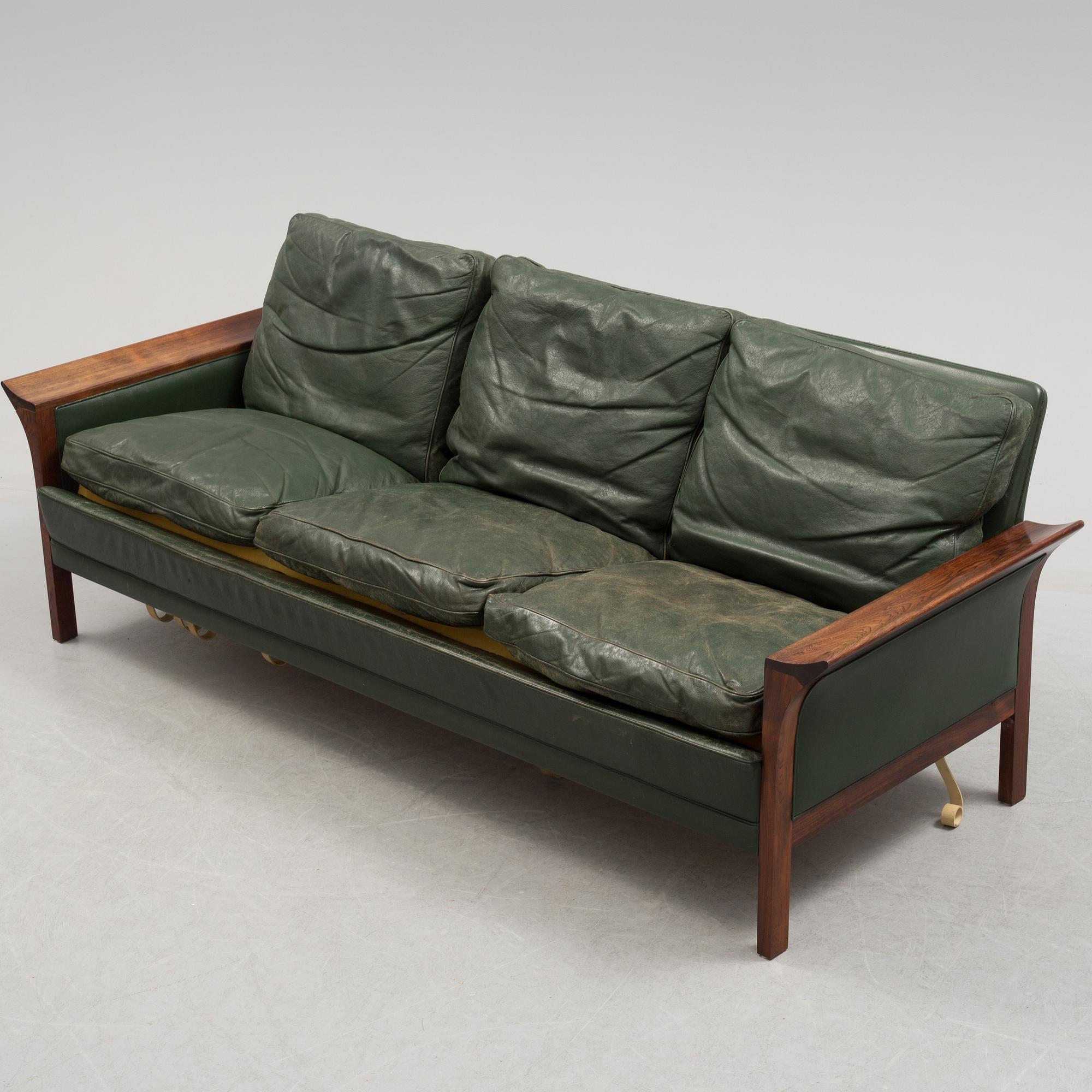 A 1960's Danish sofa, with 2 easy chairs and 2 tables by Glostrup.