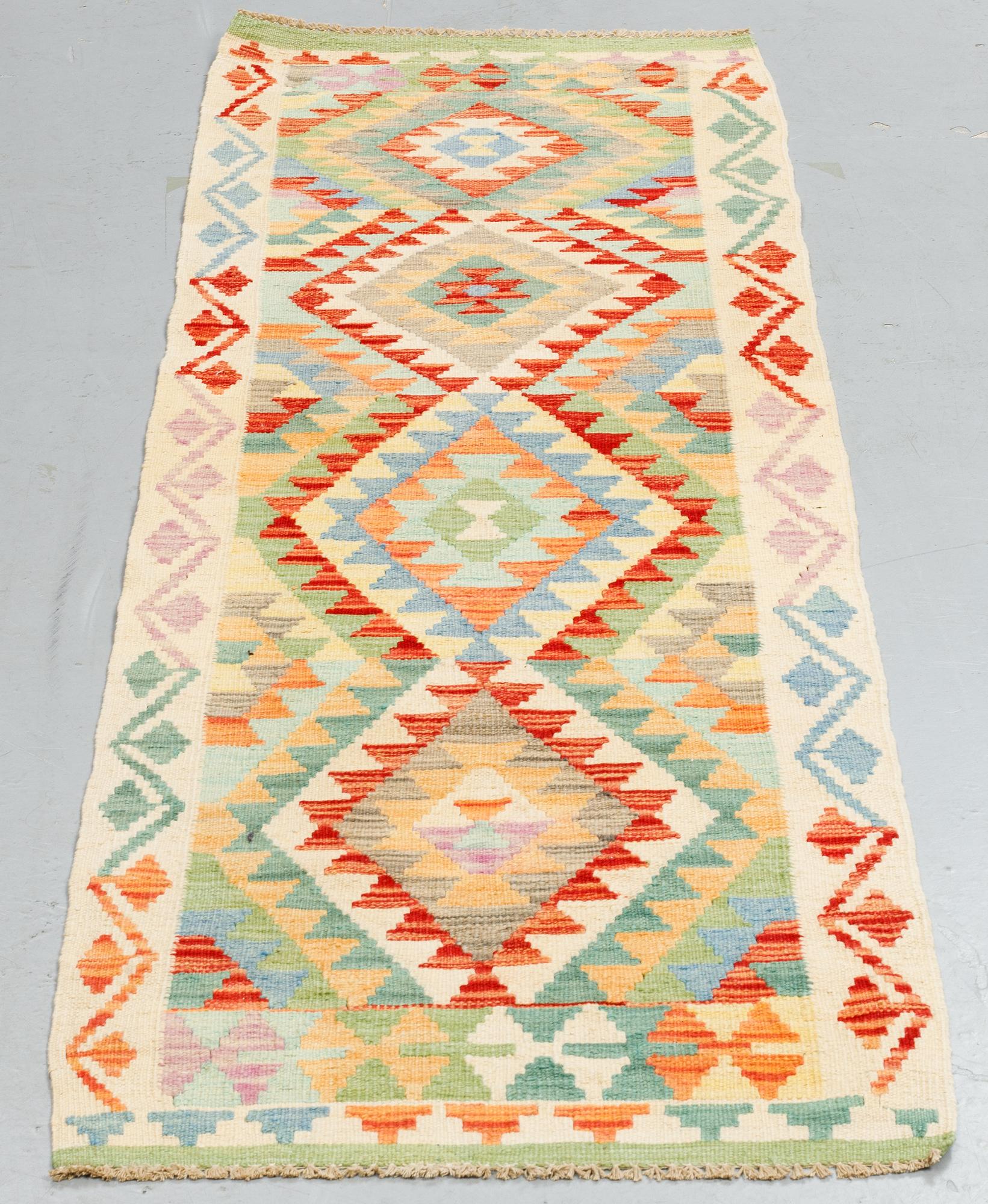 A runner, kilim, ca 199 x 66 cm.