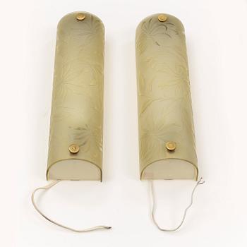 A pair of 1940s glass and metal wall lights.