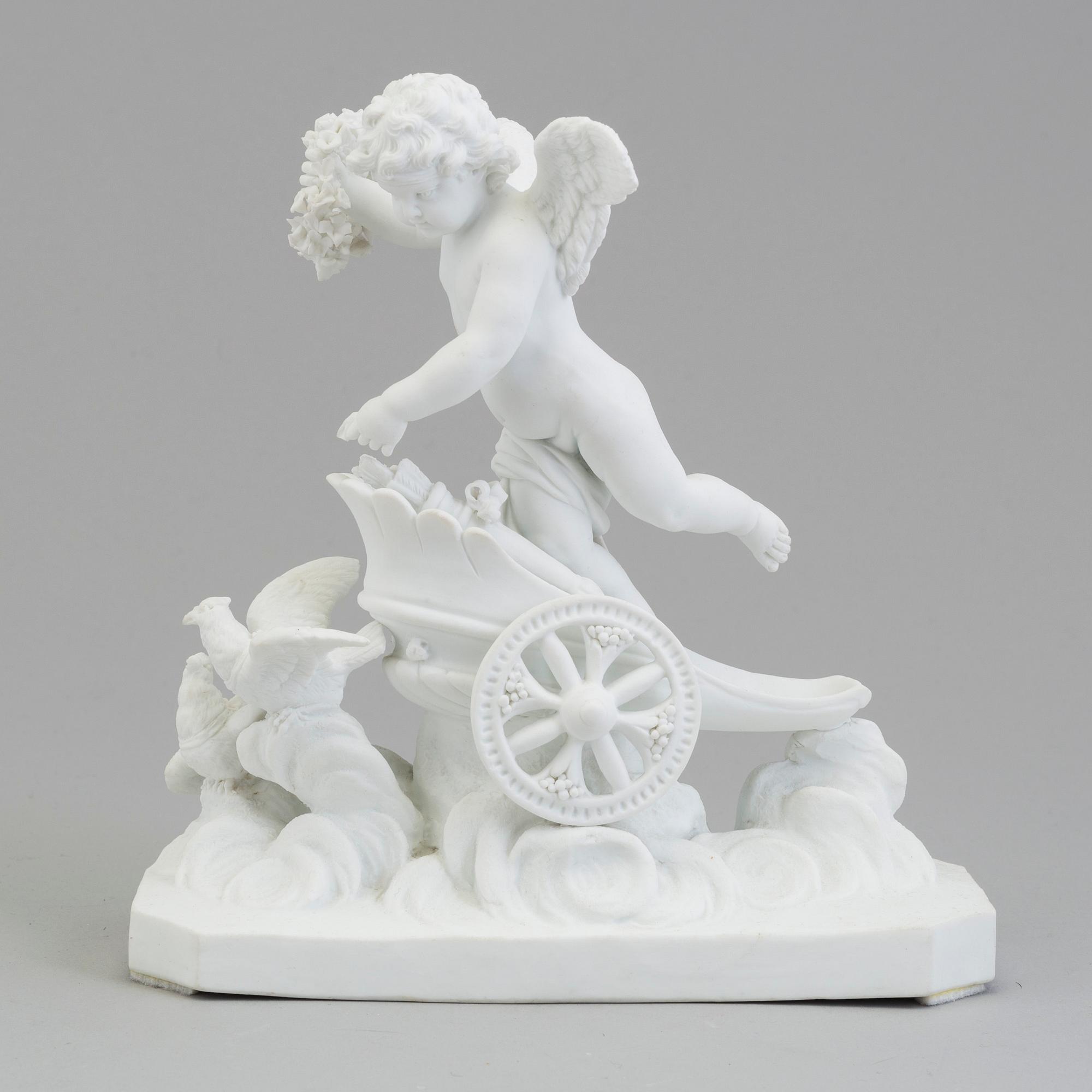 A bisquit figure of a putto on a chariot, Paris, France, possibly 18th Century.