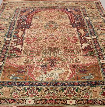 A RUG, an antique/semi-antique Kerman Laver  figural, ca 232,5 x 139,5 cm.