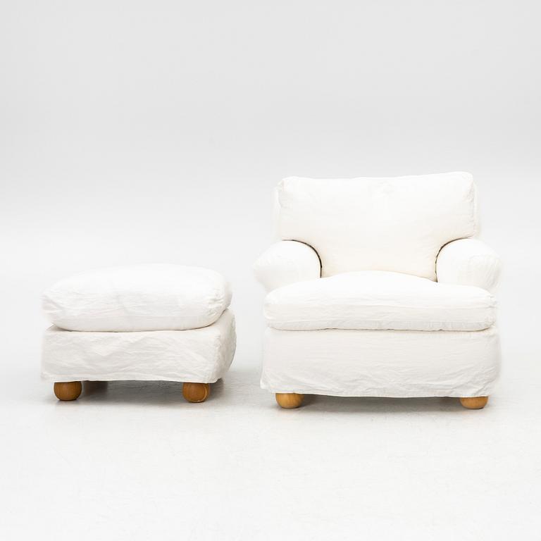 An armchair with ottoman, contemporary.