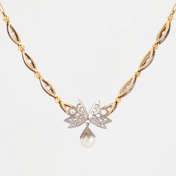 18K gold necklace with white stones and pearl.