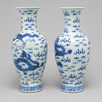 A pair of Chinese blue and white dragon vases, early 20th century, with a Qianlong mark.