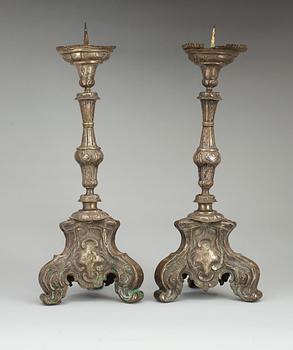 A pair of Baroque 18th Century altar candlesticks.