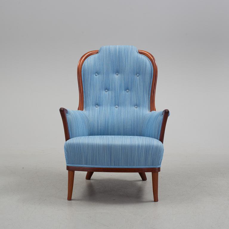 An "Vår Fru" armchair by Carl Malmsten.