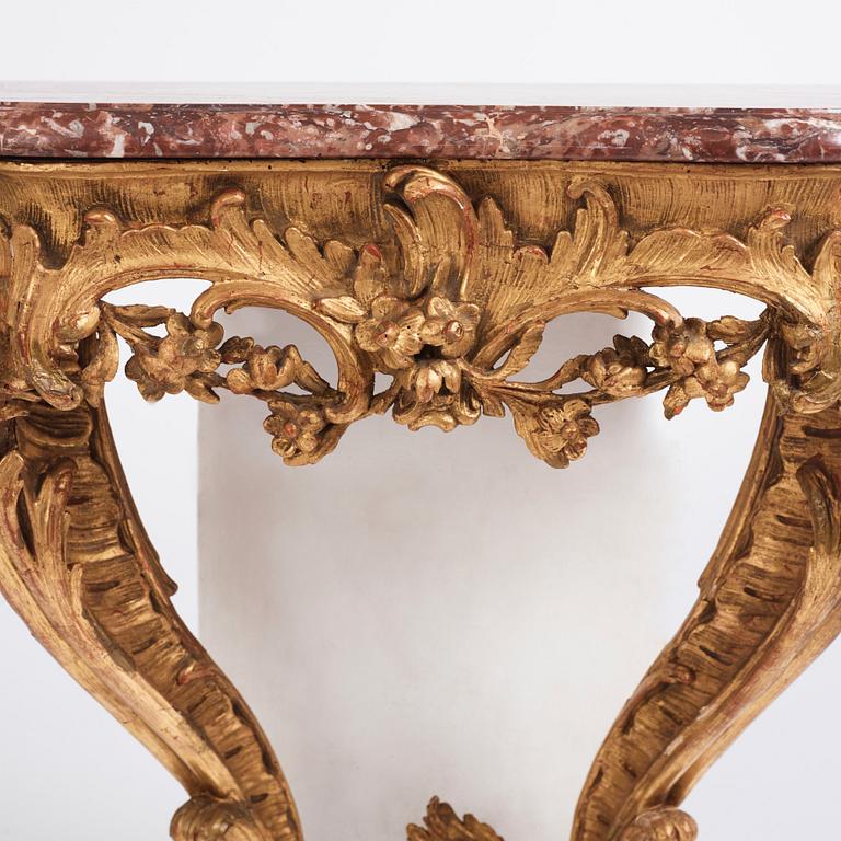 A Central European Louis XV carved and giltwood console table, mid 18th century.