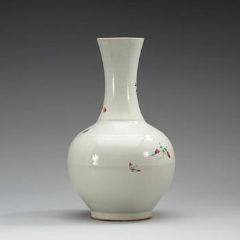 A famille rose vase, China, Republic, 20th Century, with Qianlong four character mark in red.