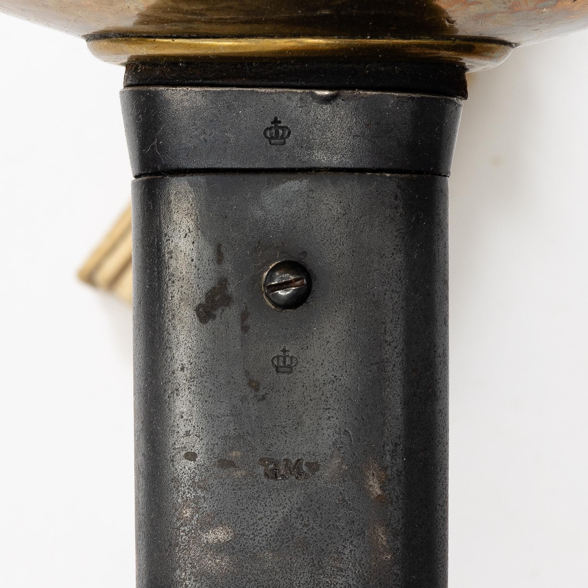 A Swedish 1893 pattern cavalry sabre, with scabbard.