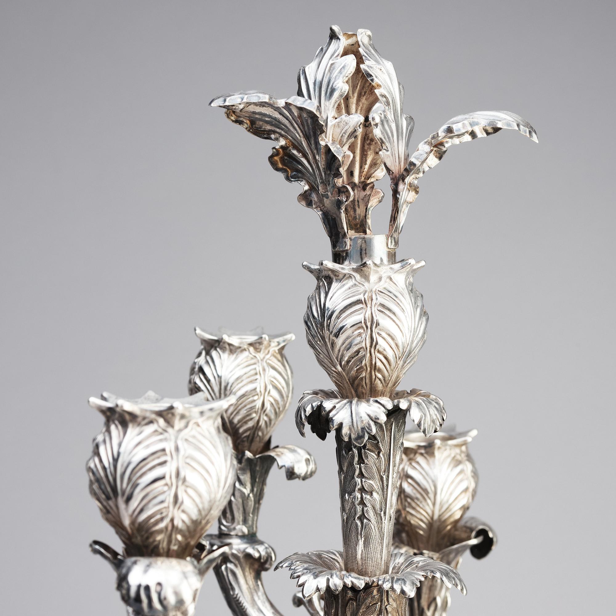 A pair of Swedish mid 19th century silver candelabra, marks of Gustaf Möllenborg, Stockholm 1844.