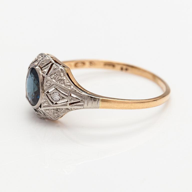 A 14K gold ring with diamonds ca. 0.02 ct in total and a sapphire. Finnish import marks.