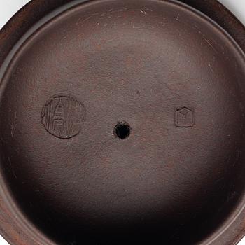 Two Chinese yixing teapots, early 1900s and 1980s.